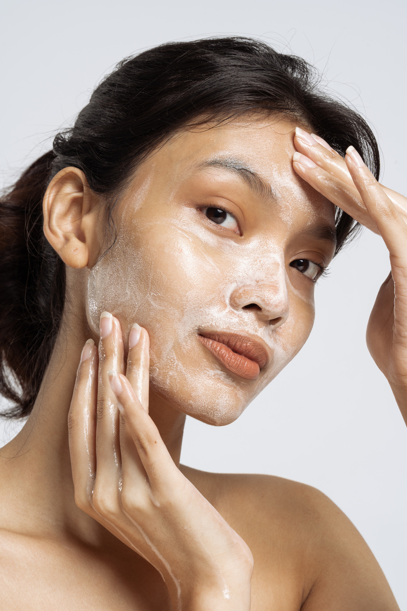 Closeup Portrait of Woman Washing Face